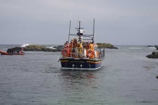 The lifeboat standing off waiting for the RIB to be manoeuvred with RIB Kracken from the Cupar Diving Club in the background.